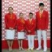 Chinese swimmer Liu, gymnast Huang, gymnast Chen and swimmer Sun pose for photographs in Chinese delegation uniforms in Beijing